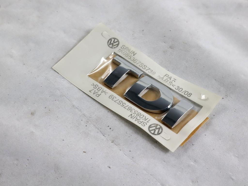 1K0853675S STEMMA FREGIO LOGO EMBLEMA "TDI" PORTELLONE COFANO POSTERIORE BAULE VOLKSWAGEN GOLF 5 1.9 D 77KW 5M 5P (2005) RICAMBIO NUOVO